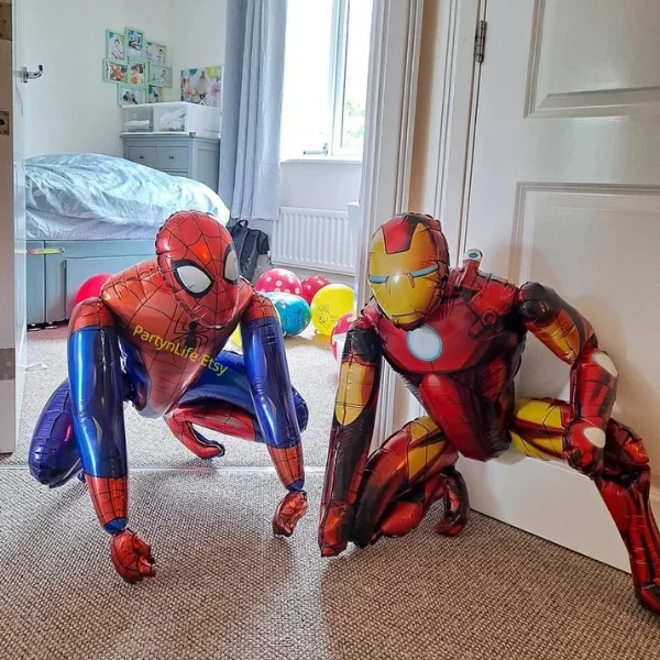 Balloons in the shape of spider man and a superhero