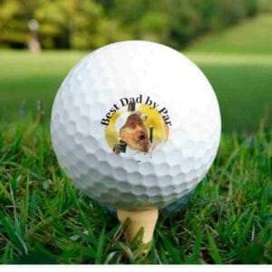a golf ball with a persons photo in middle