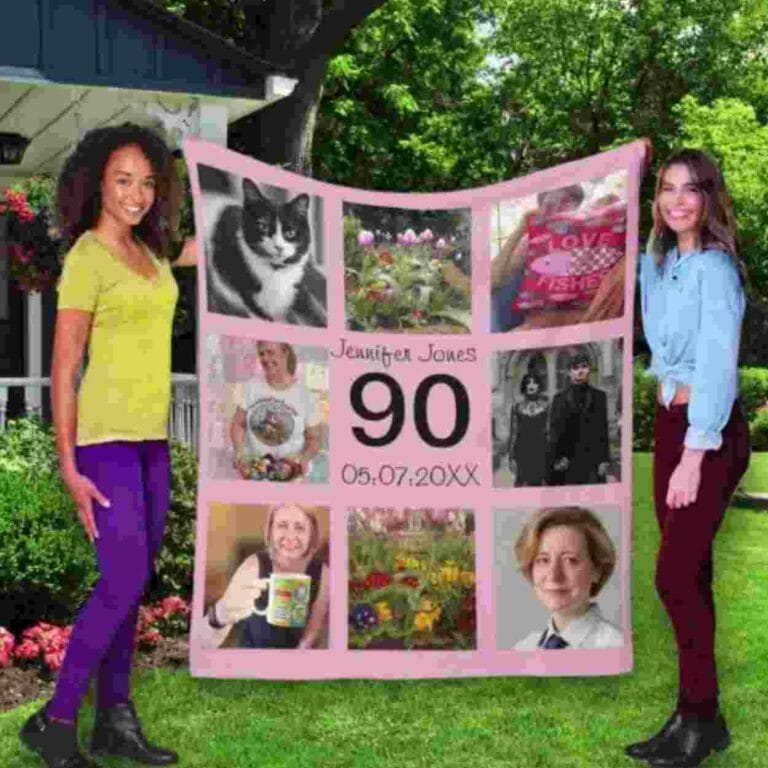 2 people holding up a large personalised blanket