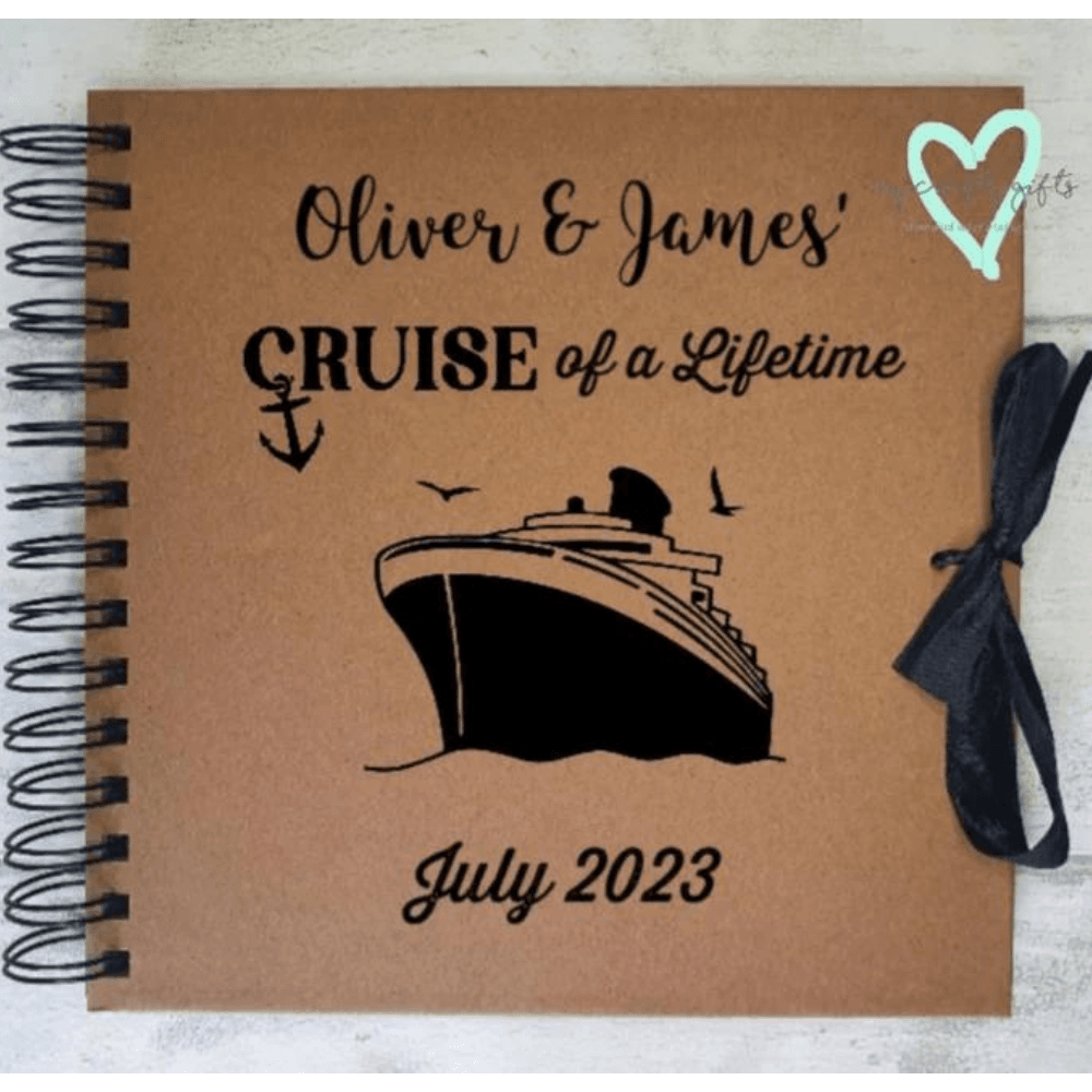 Photograph album with cover that has a picture of a silhouette of a cruise liner
