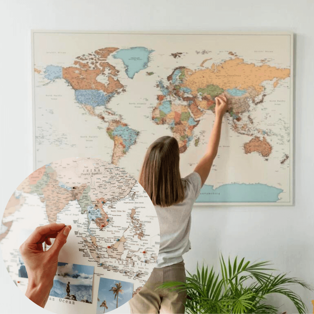 Person putting a pin on a detailed map of the world