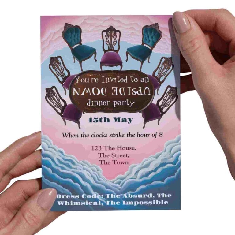 A hand holding an invitation to an upside-down dinner party