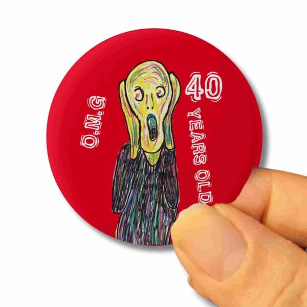 A 40th birthday badge with the design of the scream by Edvard Munch