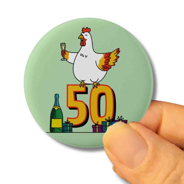 a green pin badge with a hen sat on the number 50