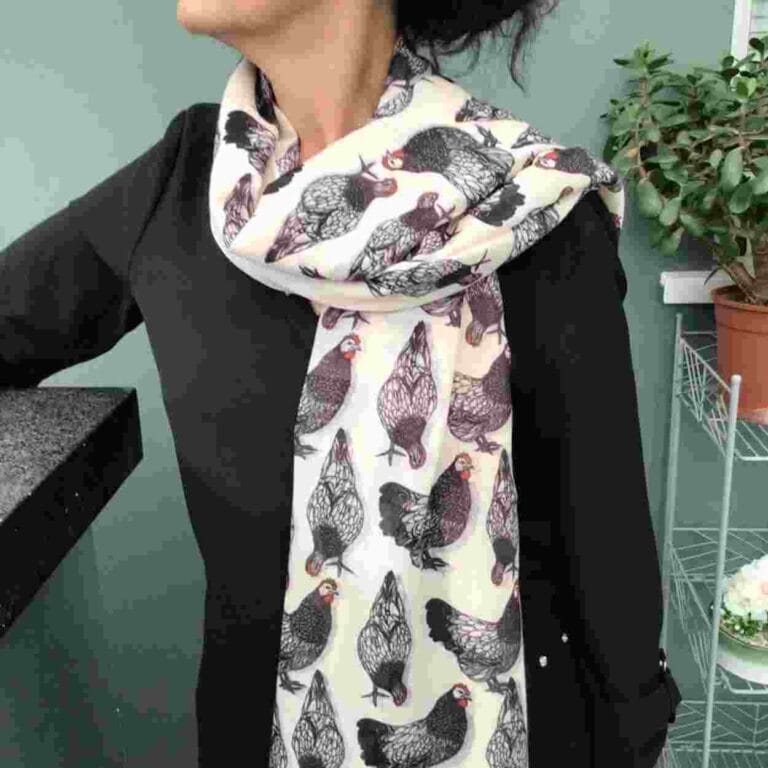 a scarf with lots of chickens printed on it