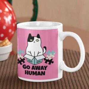 Cat sitting in a jigsaw puzzle box design on mug – cute puzzle gift for older women