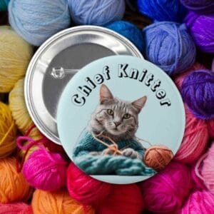 Cute cat-and-yarn enamel pin badge — fun knitting gift for older women.