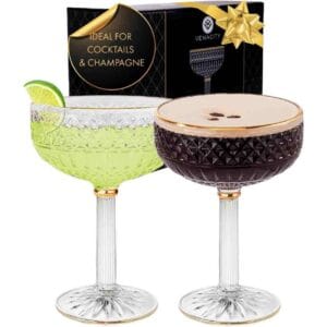 Champagne coupe glasses with lemon cocktails – classic 1920s party drinks.